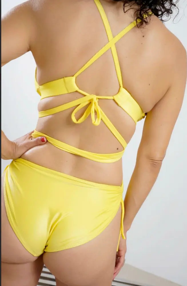 Bright yellow wet-look monokini back with cheeky seat, side ties, and wide bust support band, perfect for summer by Wild Coconuts